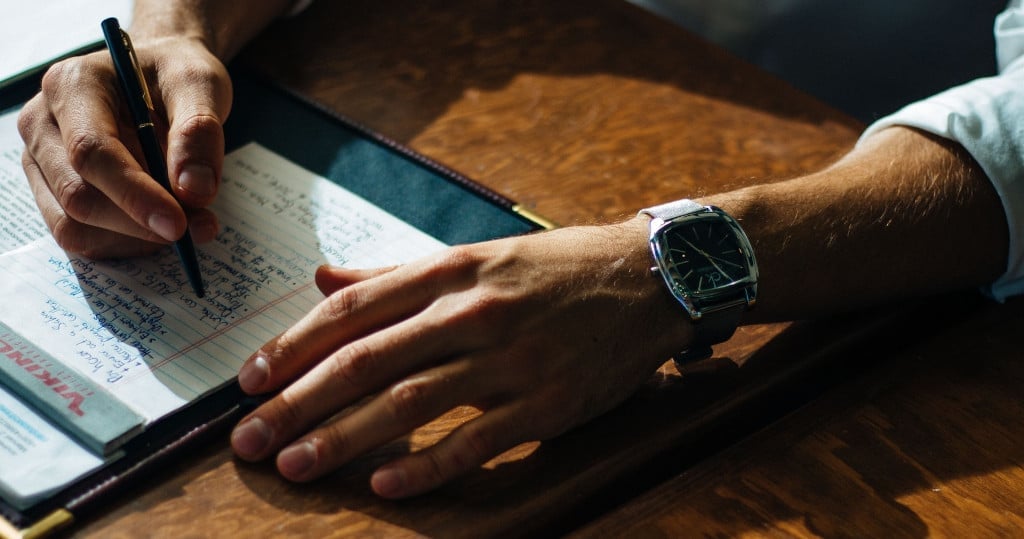 man taking notes