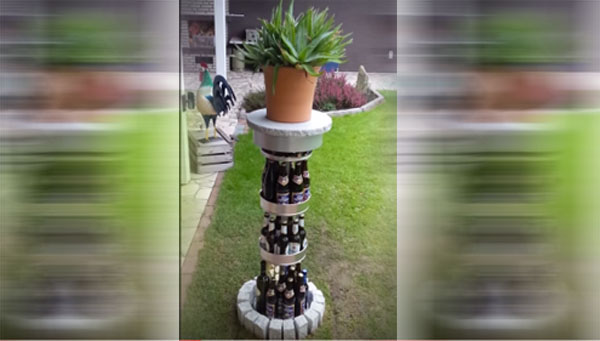 A radass dude crafts a planter using beer bottles.