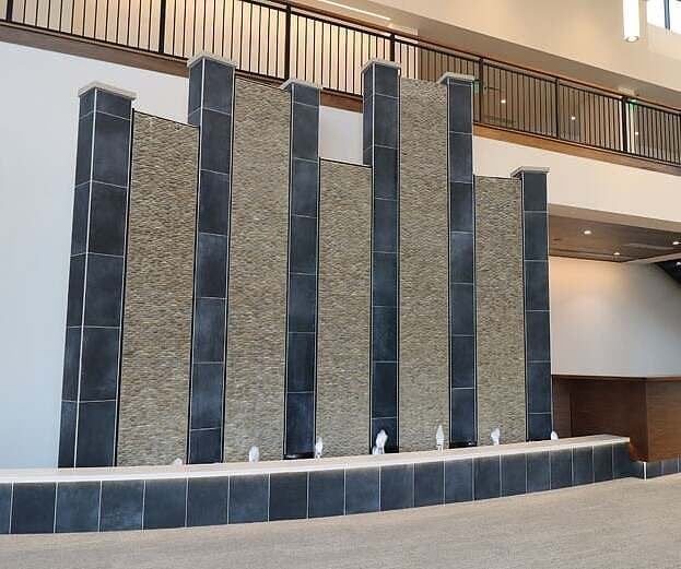 TILE WATER WALLS WITH REFLECTION POOL AND BUBBLER JETS FOR HUDSONVILLE ICE CREAM HEADQUARTERS IN HOLLAND, MICHIGAN