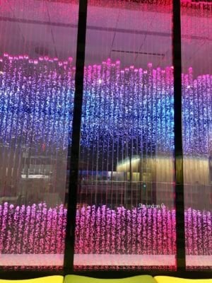 VERTICAL CHAMBER BUBBLE WALL WITH DMX LIGHTING AT OLATHE PUBLIC LIBRARY