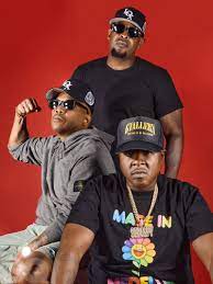 The Lox celebrating their 25th Anniversary at RamsHead Live, posing in front of a red background.