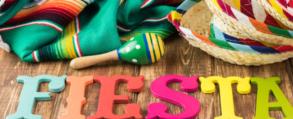 Mexican fiesta table decoration with colorful fiesta maracas, so