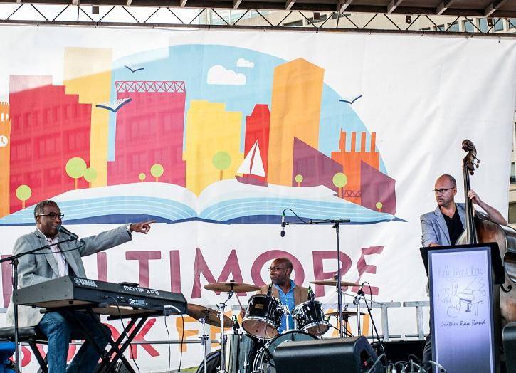 A group of musicians on stage at the baltimore book festival.