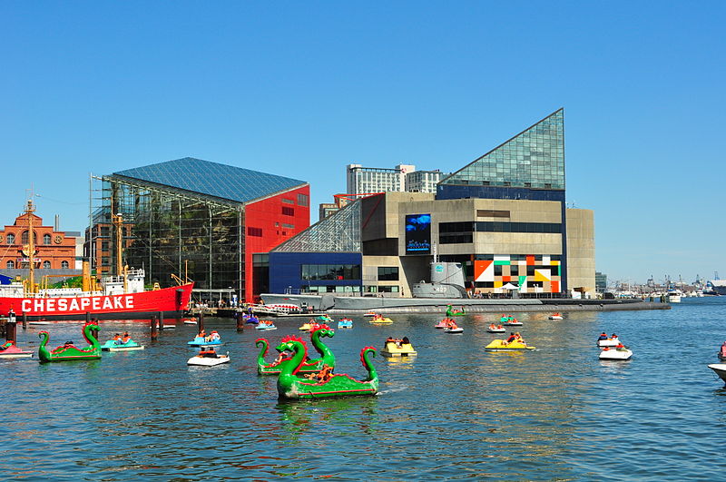 A group of people on boats enjoying a holiday voyage in Baltimore's Inner Harbor.